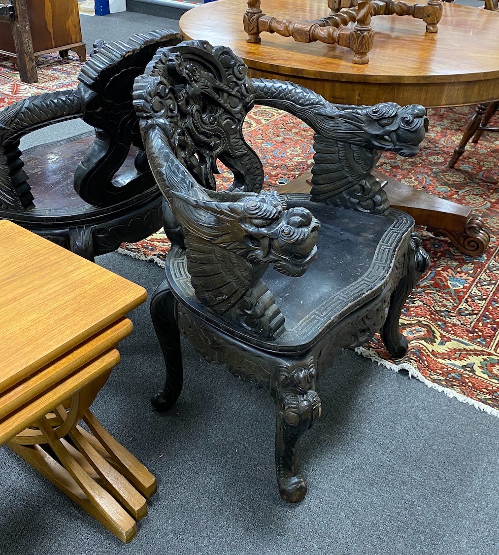A pair of early 20th century Chinese carved elbow chairs, width 64cm, depth 46cm, height 83cm